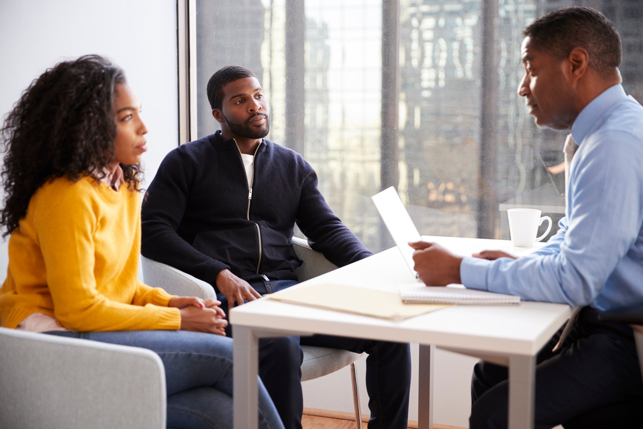 Couple Meeting with Male Financial Advisor